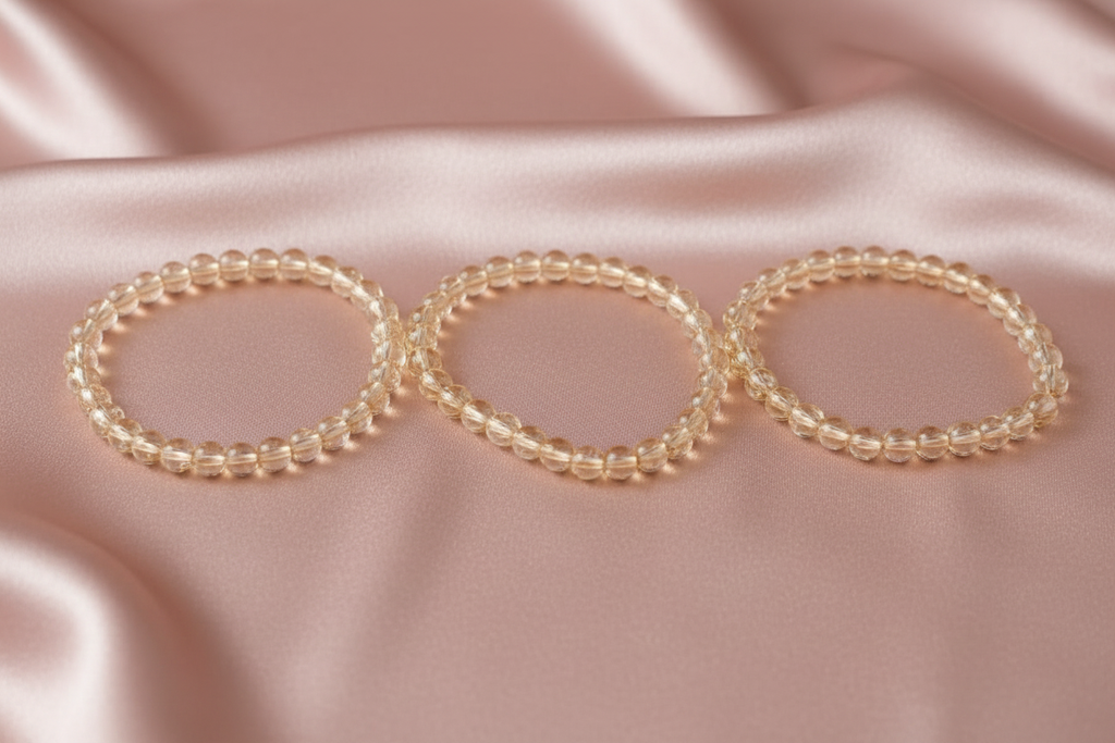 Bracelets on pink satin background