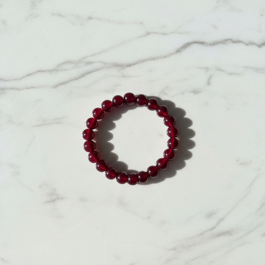 Burgundy Dark Maroon Beaded Bracelet white marble flat lay