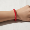 Ruby Red Beaded Bracelet on wrist minimalist
