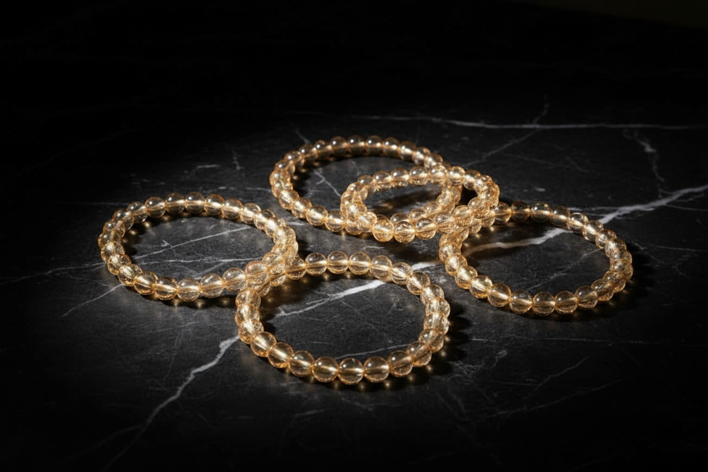 5 bracelets on black marble